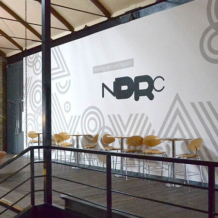 Internal shot of the grey and white wall in NDRC in Dublin which is a startup incubator