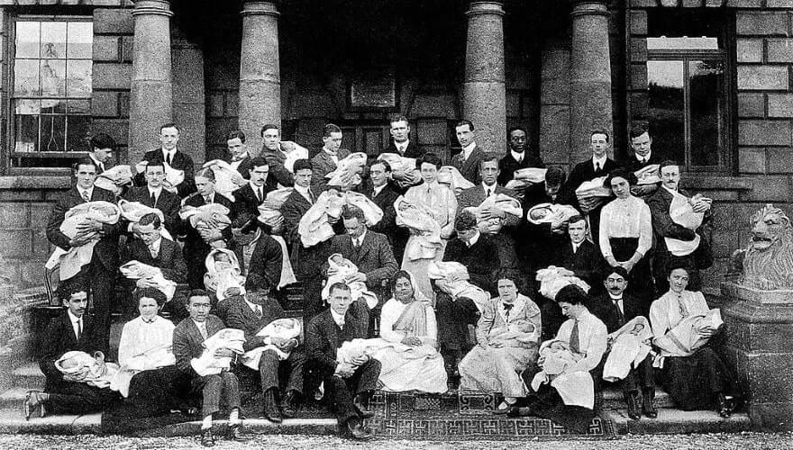 a group of students holding babies in 1911