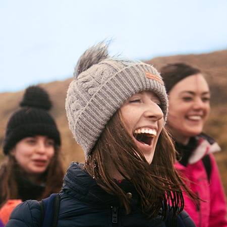 Orla O'Brien of Galz Gone Wild laughing and wearing woolly hat