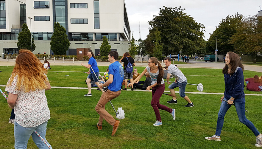 students in the harry potter society at ucd play quidditch