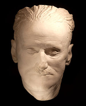 a white plaster mask of james joyce's face