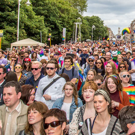 crowds march down dublin street for pride