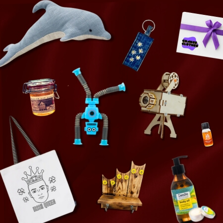 Various gifts mentioned in the guide placed at differing angles across a red background