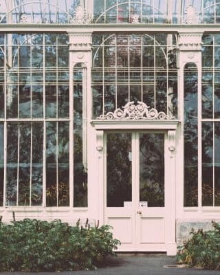 white framed victorian greenhouse at botanic gardens