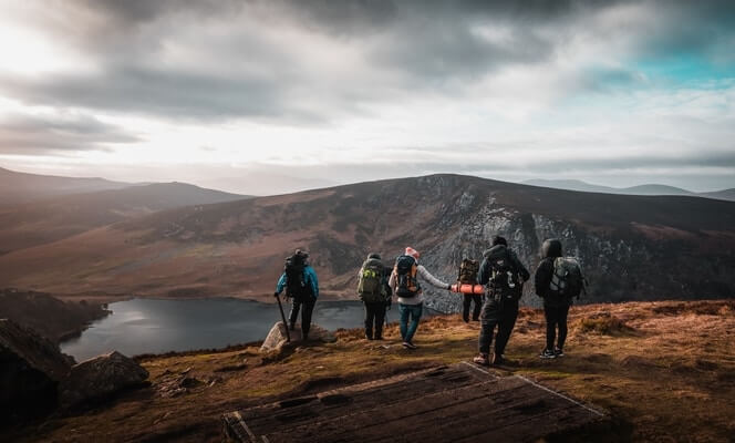 group of people hiking around lough tay